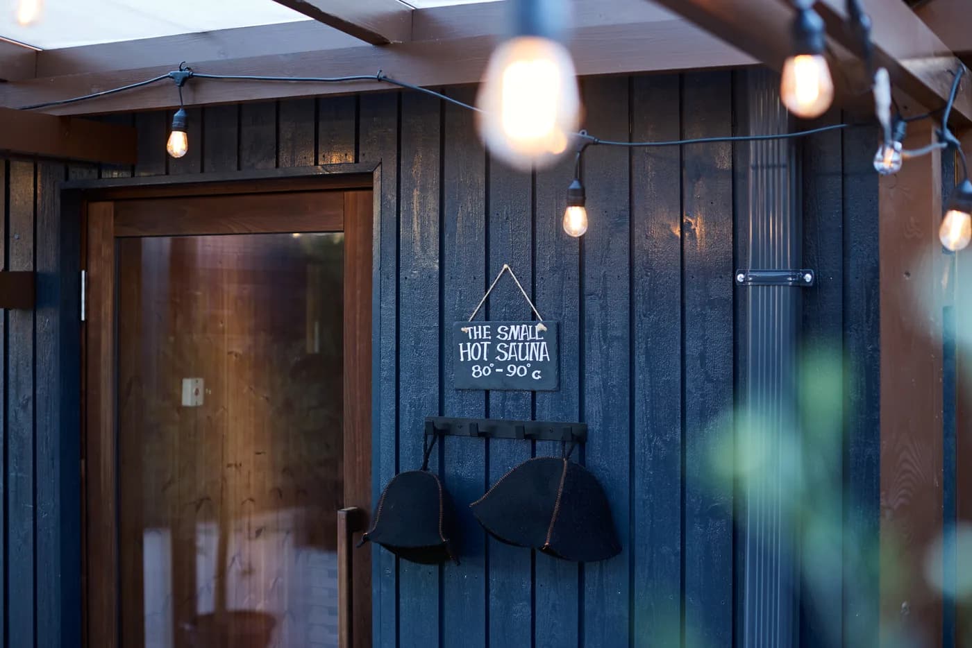 Lowlu sauna cabin under festoon lights